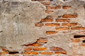 Weathered old ruin concrete wall reveal brick cracked inside grunge aged building texture for background Royalty Free Stock Photo