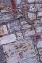 Weathered old stone wall cement big small cobble oblique pattern base loft style Royalty Free Stock Photo