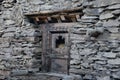 Old wooden window set into a historic stone building in Nepal Royalty Free Stock Photo