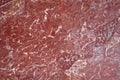 Weathered polished red marble detail