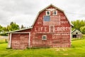 Weathered red barn with patriotic decoration Royalty Free Stock Photo