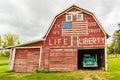 Weathered red barn with patriotic decoration Royalty Free Stock Photo