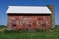 A Weathered Red Barn and Silo