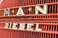 Weathered red retro rusty truck radiator panel