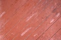 Weathered red wood door with diagonal planks