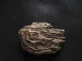 Weathered Rock On Dark Scratched Background. Legendary Artifact of Power, Courage and Healing Symbol Concept Royalty Free Stock Photo