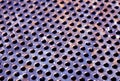 Weathered rusty metal surface with holes and blur effect Royalty Free Stock Photo