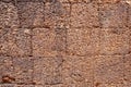 Weathered sandstone masonry. Ancient rough texture of natural stone. Porous surface closeup. Rustic grungy stone wall Royalty Free Stock Photo