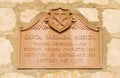 Weathered sandstone plaque at the historic Santa Barbara mission