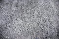 Weathered scratched concrete surface photo texture. Grunge concrete road perspective view. Rough concrete