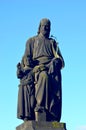 A weathered statue of St. Jospeh and Jesus.