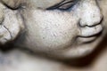 Weathered stone face of an angel or cherub Royalty Free Stock Photo