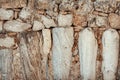 Weathered stone wall with marble details showcases ancient craftsmanship Royalty Free Stock Photo