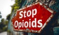 Weathered Stop Opioids Sign Displayed Outdoors, Highlighting the Urgent Public Health Campaign Against Opioid Abuse and Addiction