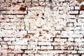 Weathered texture of stained old dark white and orange brick wall background Royalty Free Stock Photo