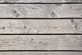 Weathered texture of the wooden decking of the path in the dunes covered with sand. Royalty Free Stock Photo