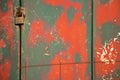 Weathered vibrant  layered green and red cracked paint on metal Royalty Free Stock Photo