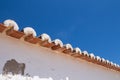 Edge of a roof and a blue sky