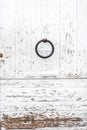 Weathered white wooden door with paint chipped and peeling.