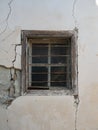 Weathered Window with Metal Bars in Crumbling Concrete Wall Royalty Free Stock Photo