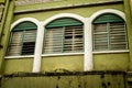 Weathered windows in asian backstreet