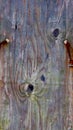 Weathered wood board with chains through holes Royalty Free Stock Photo