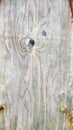 Weathered wood board with chains through holes Royalty Free Stock Photo