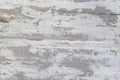 A Weathered wood texture with peeling white paint. Abstract grunge background. Royalty Free Stock Photo