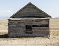 Weathered Wooden Barn Beyond Fence in Nevada Desert Royalty Free Stock Photo