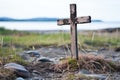 weathered wooden cross standing alone