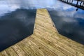 Weathered wooden dock in Luther Burbank Park on Mercer Island, WA, and a peaceful day on Lake Washington