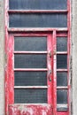 Weathered wooden door pained red