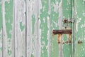 Weathered wooden door peeling green paint Royalty Free Stock Photo