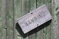 Weathered wooden door with almost vanished sign 'Private' Royalty Free Stock Photo