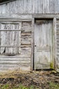 weathered wooden door and wall or abandoned farm shed Royalty Free Stock Photo