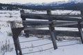 Weathered Wooden Gate Leaning Over at Old Ranch in Sierra Nevada Meadow with Mountain Backdrop (Black and White) Royalty Free Stock Photo