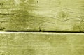 Weathered wooden painted wall in yellow color Royalty Free Stock Photo