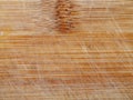 Weathered wooden plank featuring marks and knots, Aged wood with scratches knots and rich honey hues Royalty Free Stock Photo