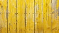 Weathered yellow timber planks with peeling paint and rusted surface Royalty Free Stock Photo