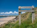 Weathered wooden sign on the Pembrokeshire Coast Path Royalty Free Stock Photo