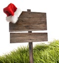 Weathered wooden sign with Santa hat on white Royalty Free Stock Photo