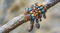 A weathered wooden staff adorned with beads and charms used by traditional healers during healing ceremonies. The staff