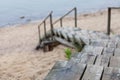 Weathered wooden stairs leading to the beach from the sand dunes Royalty Free Stock Photo