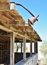 Weathered wooden structure in the desert.