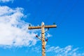 Weathered wooden utility pole with parallel single-circuit lines and colorful isolators in the blue sky Royalty Free Stock Photo