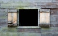 Weathered wooden wall with open window on colonial barn Royalty Free Stock Photo