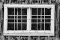 Weathered and worn window on a barn equipment shack that stored mining equipment - old, chipped peeling Royalty Free Stock Photo