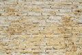 Weathered yellow brick wall