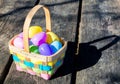 Wicker Easter basket filled with colorful eggs Royalty Free Stock Photo