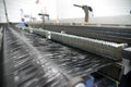 Weaving automatic machines - Weaving is a method of textile production in which two distinct sets of yarns or threads are